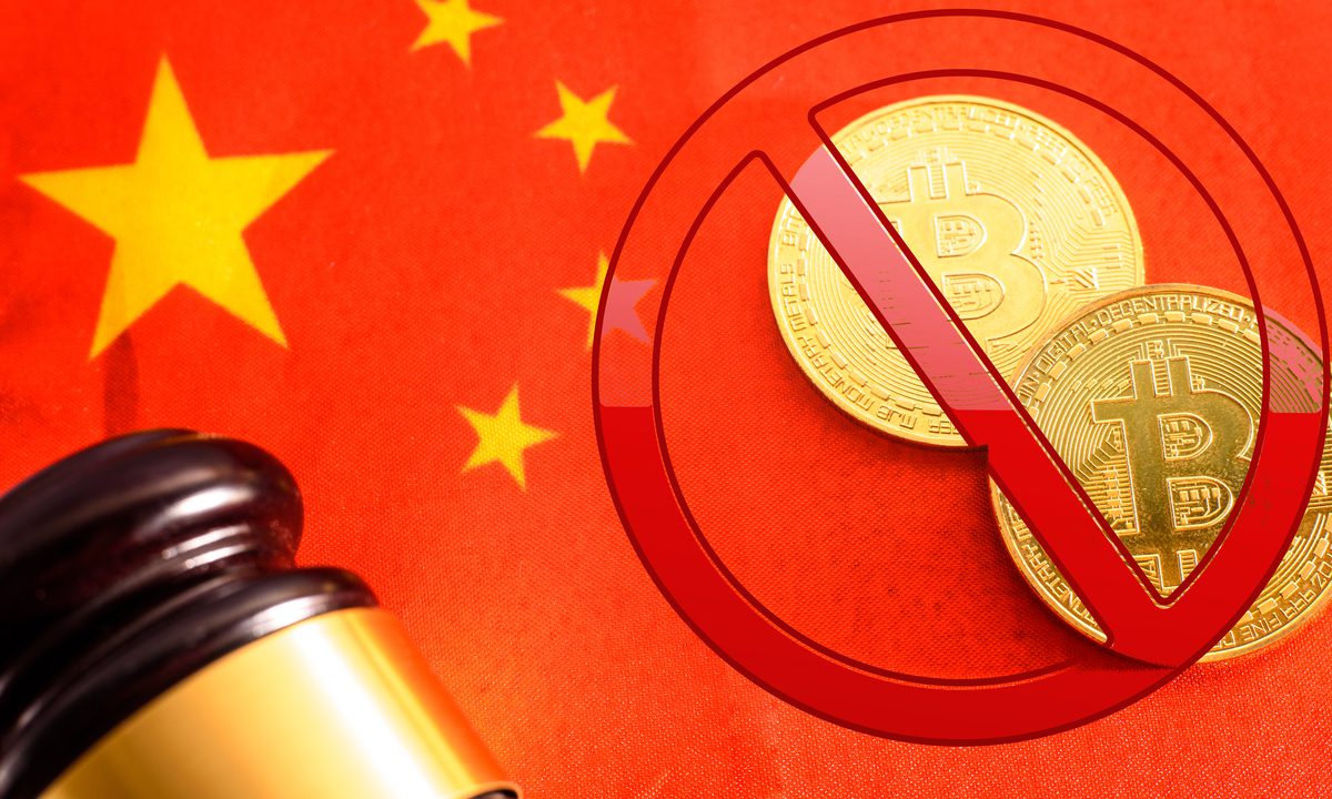 Bruised by stock market, Chinese rush into banned bitcoin | Reuters