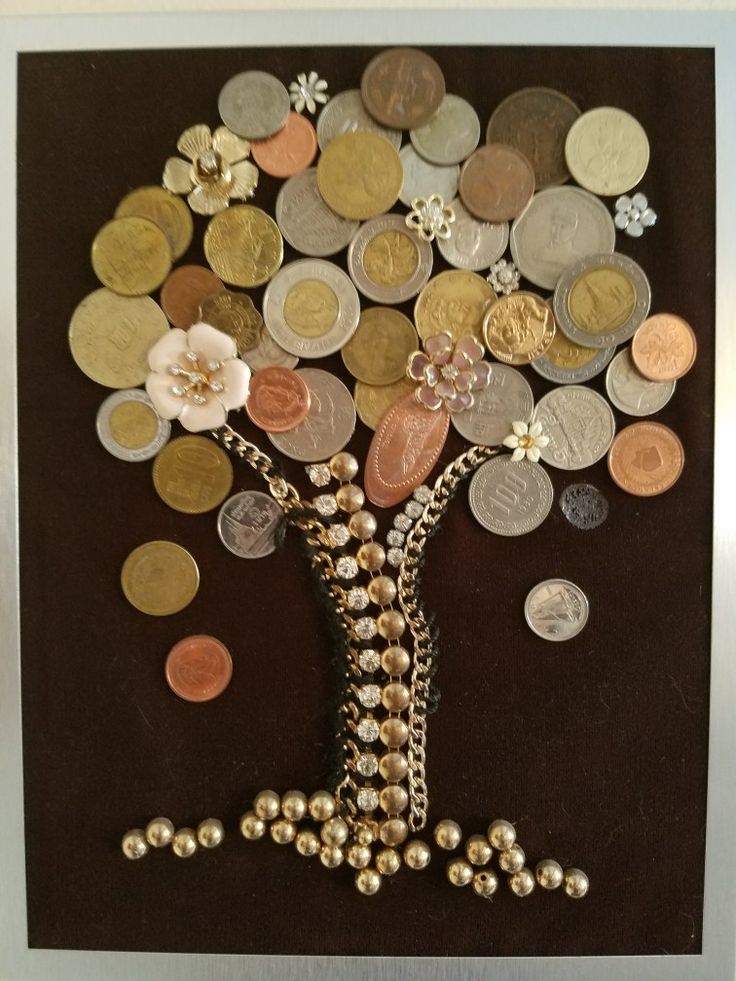 A tree of copper wire with coins. Handmade crafts. Money tree фотография Stock | Adobe Stock