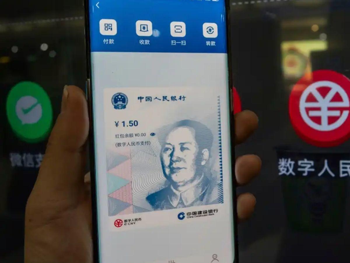 China's digital yuan transactions seeing strong momentum, says cbank gov Yi | Reuters