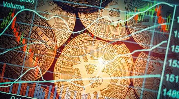 U.S. futures-based bitcoin ETF rises in first day of trading, bitcoin nears record | Reuters